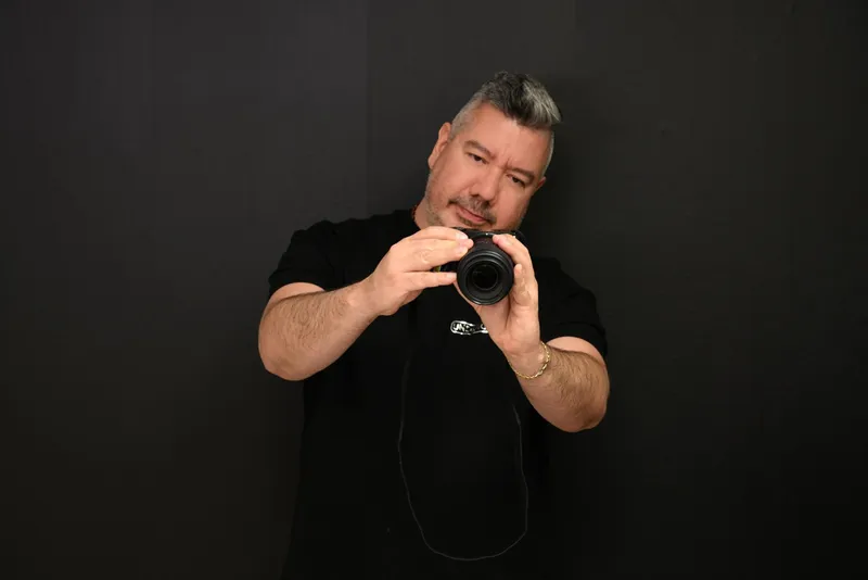 Ender, photographer and owner of By Ender Photography, in his Oakland Park studio
